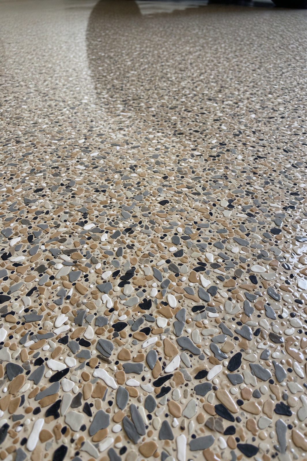 Close-up of black, white and gray decorative flake floor texture